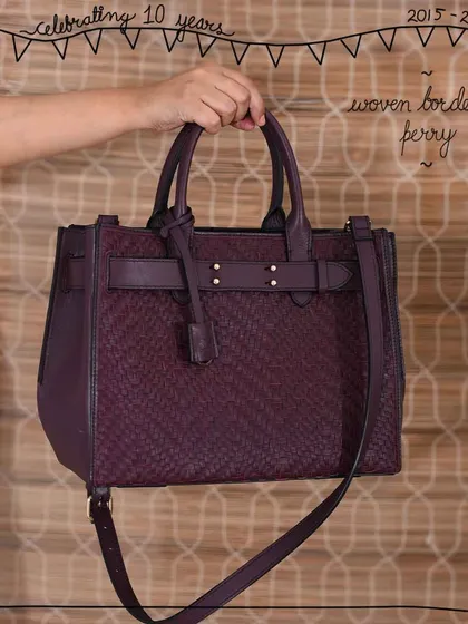 The structured Perry tote bag is transformed by our Woven Edit. This version in a deep Woven Bordeaux leather shows how hand-weaving adds a layer of texture and sophistication to a classic work-to-weekend bag.