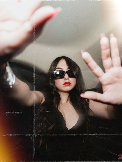 Another creative shot playing with hand gestures and perspective.