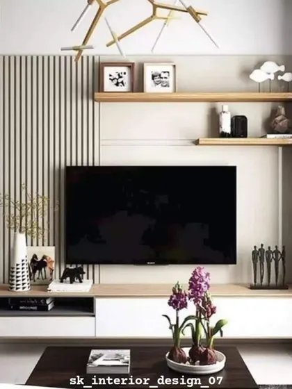 A simple yet elegant TV unit with wood-look panels and open shelving. The design is complemented by modern art and decorative items, reflecting the homeowner's personality.