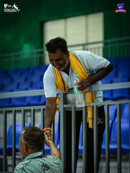 A handshake of appreciation with our support staff after the semi-final.
