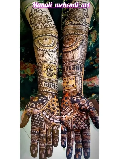 This bridal mehandi has the names 'Seema' and 'Rajan' written inside decorative frames on the arms. The design also includes a kalash for good fortune and intricate dot-work.