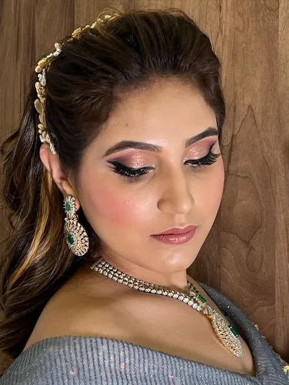 This image highlights the beautiful shimmer on the eyelids and the soft texture of the waves. It's a great example of a complete, polished party look.