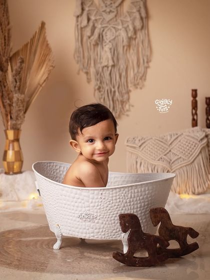 "Hey you there! What are you looking at?" A cheeky little one enjoys a bath in our beautifully styled boho setup.