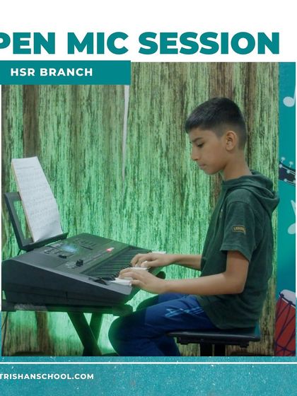 A student reads sheet music while playing the keyboard at our HSR branch open mic.