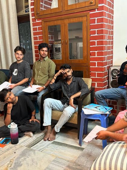 Fellows listen intently during a training session. We equip them with a toolkit of facilitation techniques to help them inspire and engage young minds effectively.
