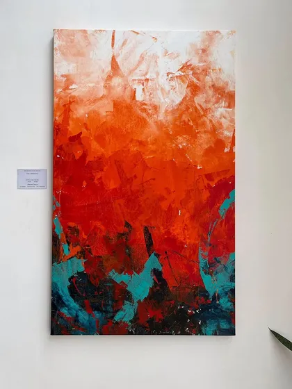 'The Uprising', a 5x3 feet vertical abstract, is an explosion of energy. I use thick layers of acrylic paint, contrasting fiery reds with calming turquoise to create a piece that feels both powerful and balanced, perfect for a modern statement wall.