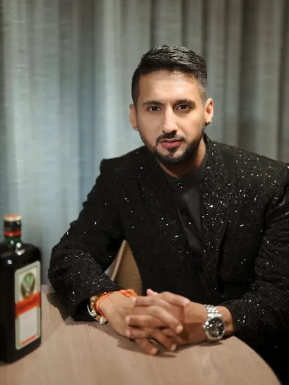 A confident groom ready for his cocktail night. The grooming is subtle, ensuring he looks sharp and polished in person and on camera without looking like he's wearing makeup.