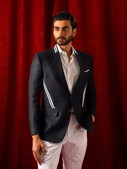 Another angle of the modern black blazer, demonstrating its versatility and sharp silhouette.