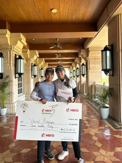 Rhea Jha stands with winner Vani Kapoor at the Hero WPGT. Competing alongside top professionals is a critical part of our students' development.