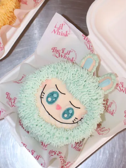 Introducing our Labubu Mystery Lunchbox Cake. You choose the flavor, and we surprise you with one of our cute Labubu character designs. This one features a sweet, mint-colored face.