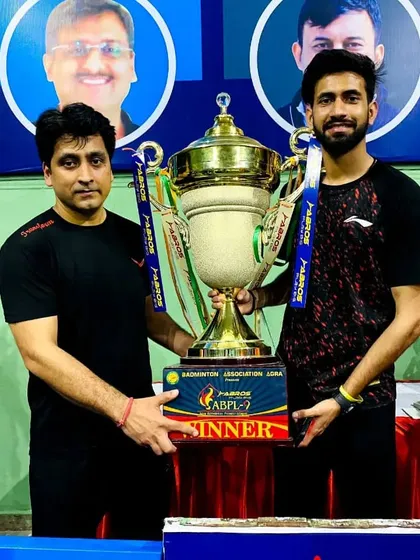 Our Head Coach, Ravindra Singh, with the winner's trophy from the Agra Badminton Premier League. Our coaching staff consists of active, high-performing players who bring current, real-world tournament experience to our students.