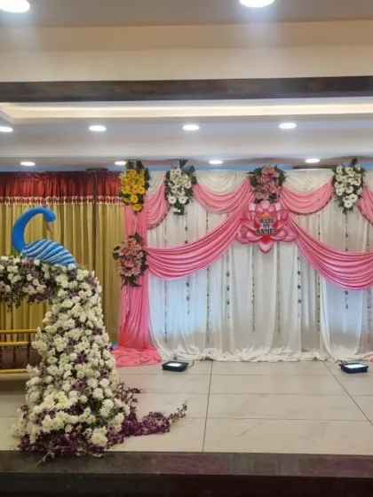 Another angle of the pink-themed naming ceremony, showing the peacock-shaped floral piece on the cradle. It’s these little details that make each decoration unique and special.