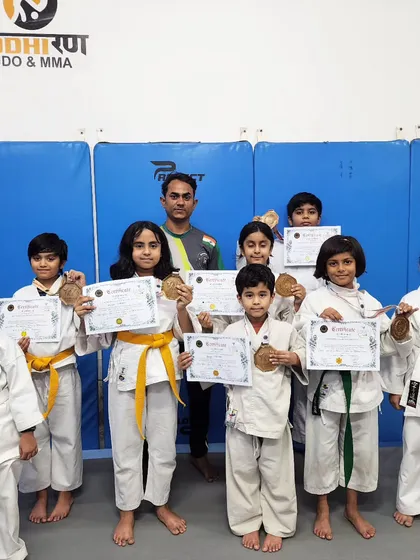 Our girls are champions. Here is our team from the Sansinkan Open Karate Championship, each one holding a medal and certificate earned through dedication. We are committed to empowering young girls through the strength and confidence of martial arts.