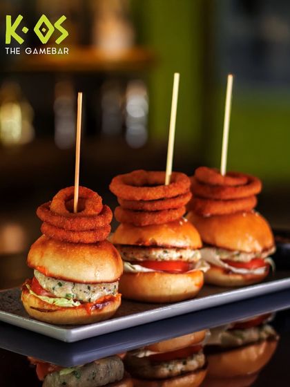 Small but mighty. Our chicken sliders are stacked high with crispy onion rings, making them a perfect bite-sized meal.