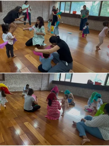 Children and parents dancing with colorful scarves during our "Banjo" collection. Using props like scarves helps children visualize the music and express themselves freely.