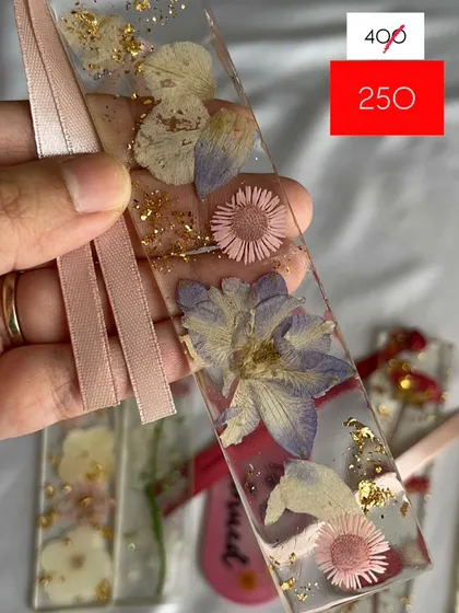 A beautiful mix of purple and pink flowers in this mini bookmark, now on sale.