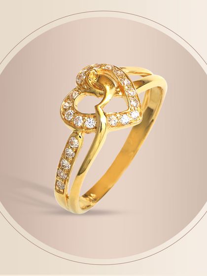 A classic double-heart gold ring, fully encrusted with sparkling diamonds. This is a timeless piece that symbolizes love and commitment, making it a popular choice for anniversaries and special occasions.
