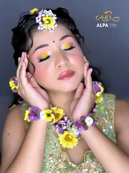This shot highlights the delicate floral bracelets and rings, all handcrafted in-house.