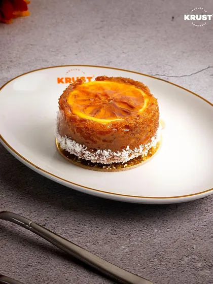 Another perspective of the Orange Ginger Tea Cake on our signature plate. It's a unique flavour that has become a favourite among my regulars.