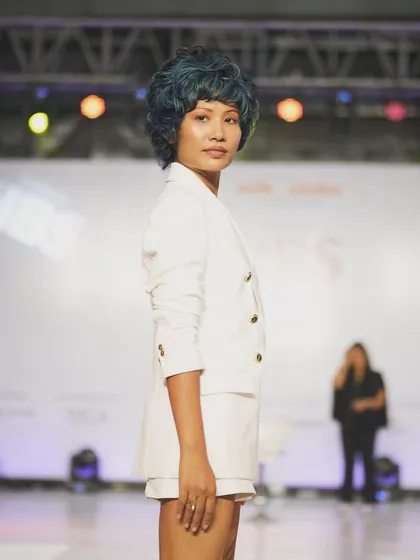 On the runway for the Wella Professionals showcase, I created this edgy and modern makeup look. The clean skin and defined eyes were designed to complement the bold, blue-toned creative hairstyle, making a strong statement on stage.