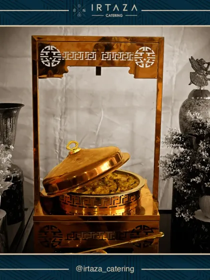 This unique serving station with its ornate gold frame is a statement piece, perfect for highlighting a signature dish and adding a touch of royalty.