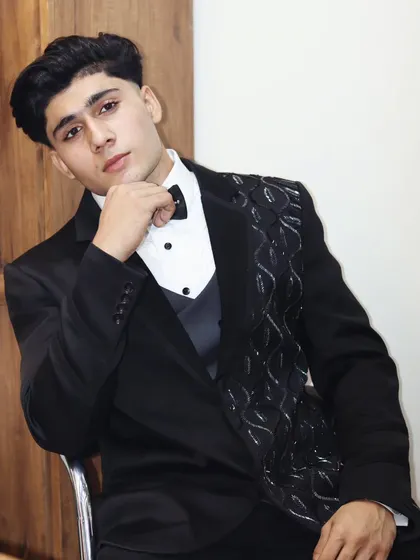 A custom black tuxedo with unique lapel embroidery. This is for the client who wants a subtle but distinctive detail to make their formalwear one of a kind.