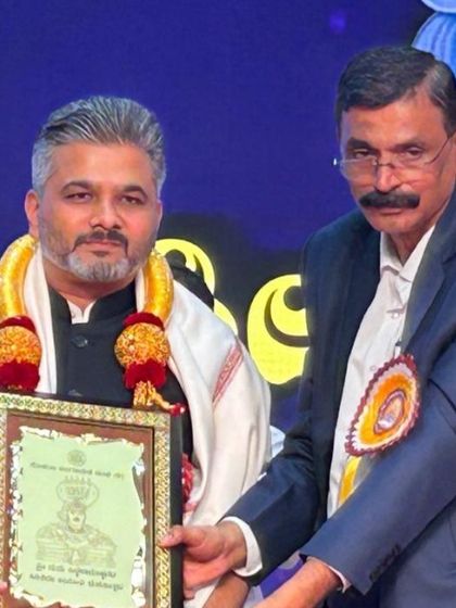 A closer look at the felicitation during the Siddharameshwara Jayanti event. I am humbled to be recognized in the presence of so many esteemed leaders and devotees.