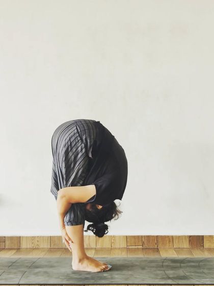 Uttanasana, or Standing Forward Bend. This pose is a great way to stretch the hamstrings and release tension in the back. With practice, you can deepen the bend and bring your head closer to your knees.