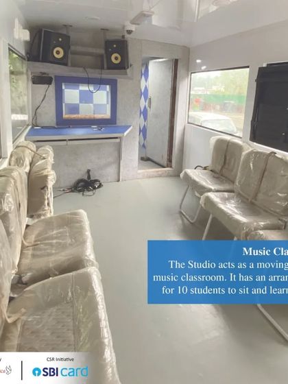 The interior of the Music Bus, designed as a mobile classroom. It has seating for up to 10 students, creating an intimate and focused space for learning music on the go.