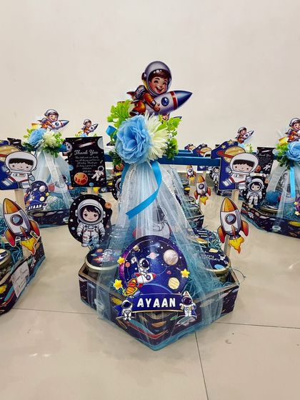 A whole fleet of galaxy-themed hampers ready for Ayaan's birthday party guests. We ensure every single hamper is perfect.