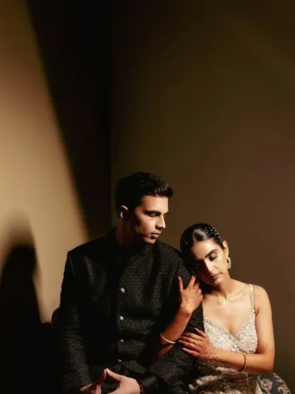 This is for the modern couple. We use dramatic lighting and shadow to create an editorial, high-fashion feel. The focus is on the quiet connection and emotion, proving that powerful portraits don't need a grand setting, just a strong bond.
