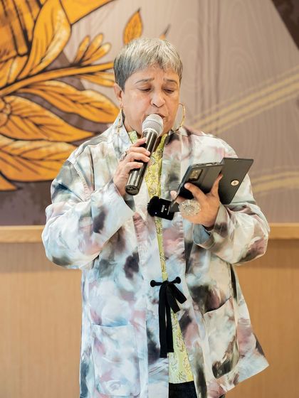 An experienced poet shares her wisdom on the "Voices of the Nation" theme. The event was a heartfelt gathering of writers and enthusiasts.