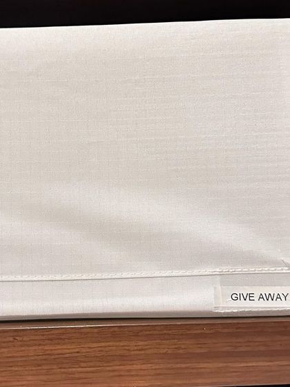 A "Give Away" bin in the closet is a great idea. Whenever you come across an item you no longer want, simply put it in the bin. This makes decluttering an ongoing, easy habit.