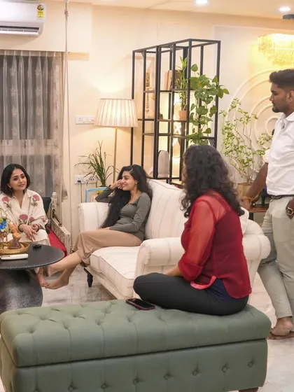 A photo of me and my team interacting with clients in their living room.