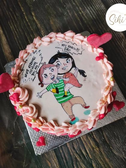 Hand sketching has been a recent favorite. This cake features a funny and personal cartoon of a brother and sister, capturing a unique inside joke.