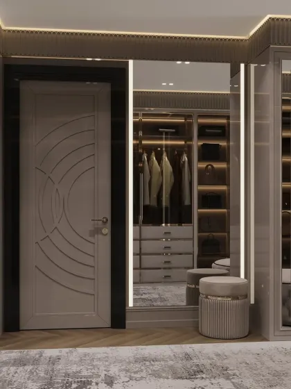 The entrance to the closet features a custom-designed door and a full-length mirror, creating a grand sense of arrival.