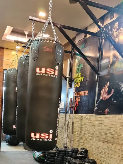 Welcome to Fitwithbox, my studio in Yamuna Vihar. No frills, just everything you need to get brutally strong: heavy bags, weights, and the space to grind. This is our ranbhumi (battlefield).