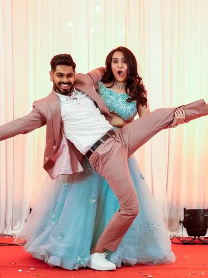 A fun and quirky pose from the couple's sangeet performance. This shows their playful side.