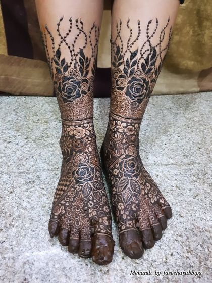 Another shot of Neha's bridal legs, showcasing the beautiful contrast between the dark henna and the skin.