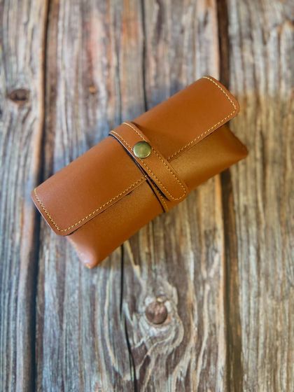 A classic brown leather sunglasses case, part of our Father's Day gift collection. A stylish and practical gift for dad.