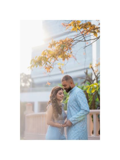 A tender moment of connection during a sun-drenched Haldi celebration. The soft light and gentle pose create a romantic and peaceful portrait amidst the festivities.