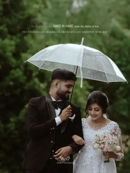 "Hand in hand, under the shelter of love." This romantic shot of the couple under a clear umbrella perfectly captures their bond.