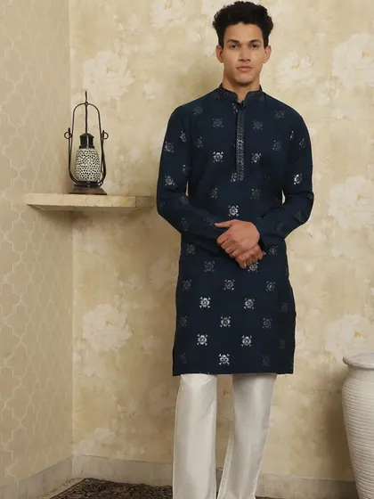How will you make this Diwali memorable? Elevate your festive wardrobe with this exquisite navy blue embroidered kurta pajama, designed to bring out your best self.