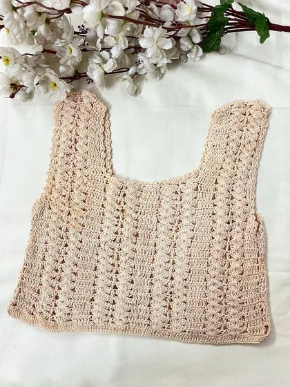 The same sleeveless crop top design shown in a soft, neutral beige color. We can create our designs in any shade you prefer.