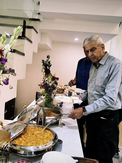 Guests enjoying the buffet at a house party in Delhi. My setups are designed to be as user-friendly as they are beautiful, ensuring a smooth flow for your guests.