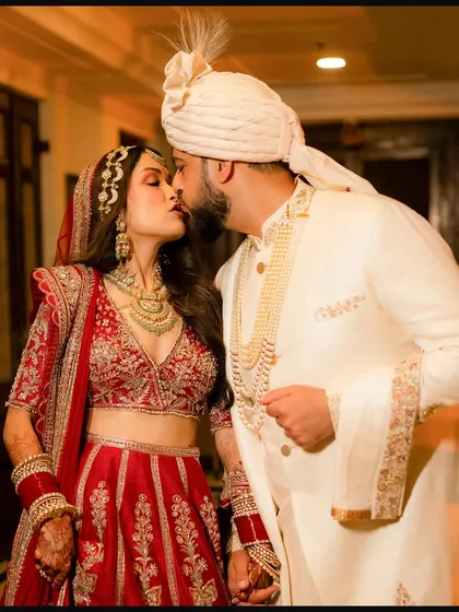 An intimate and tender kiss between the newly married couple, Raoul and Sushmita. This candid shot, taken right after the main ceremony, captures the immediate joy and love that marks the beginning of their new journey together.