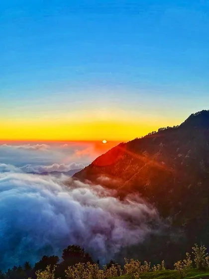 Another glimpse of the fiery sunset from Triund. The sky puts on a show that makes the entire climb worth it.