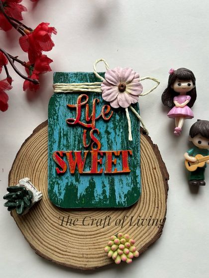"Life is Sweet." A rustic, jar-shaped wooden fridge magnet that adds a touch of charm to any kitchen.