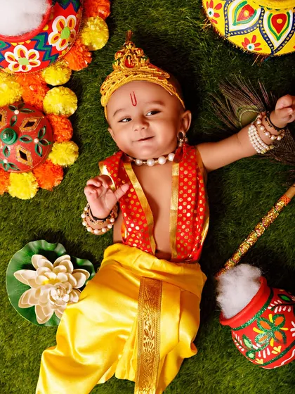 A top-down shot of a baby Krishna, used to promote the festive mini sessions.