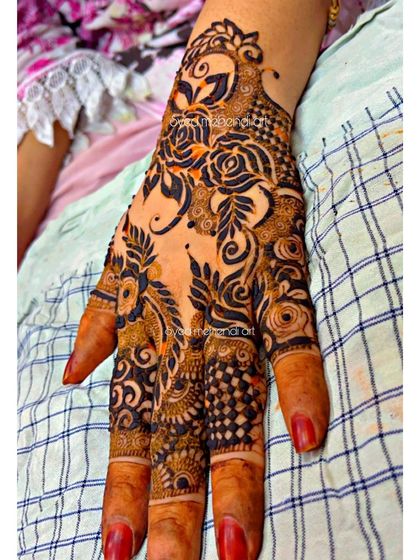 A close-up of the previous design, showing the intricate work on the fingers.